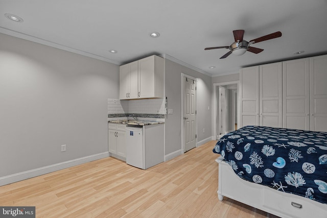 bedroom with ceiling fan, light wood-type flooring, and crown molding