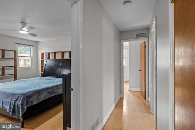 bedroom featuring ceiling fan and light hardwood / wood-style floors