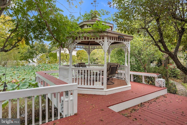 wooden deck featuring a gazebo