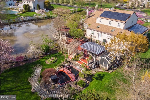 birds eye view of property featuring a water view