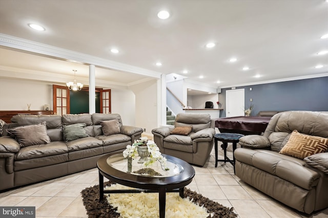 living room with crown molding, light tile patterned floors, and a notable chandelier