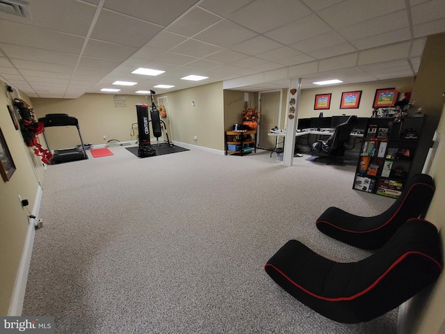 interior space with carpet flooring, baseboards, visible vents, and a drop ceiling