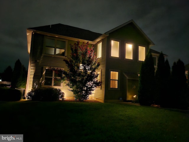 view of front of home with a lawn