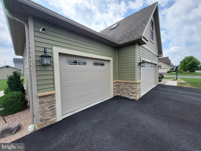 garage featuring driveway