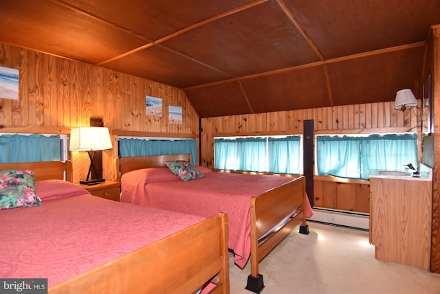 bedroom with a baseboard radiator, wooden walls, carpet flooring, and vaulted ceiling