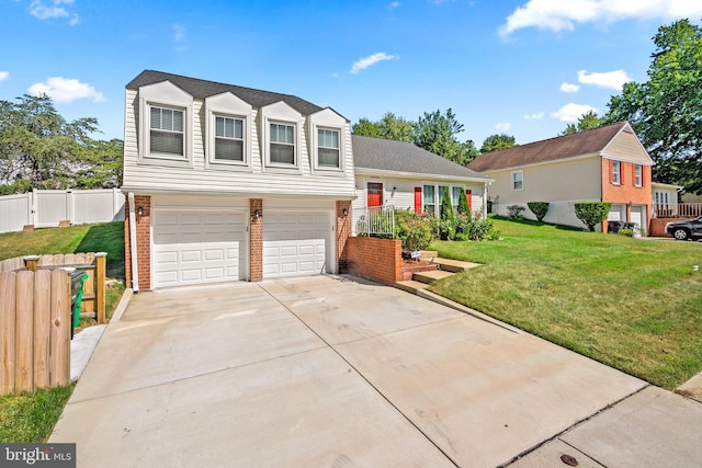 split level home with a garage, brick siding, fence, driveway, and a front lawn