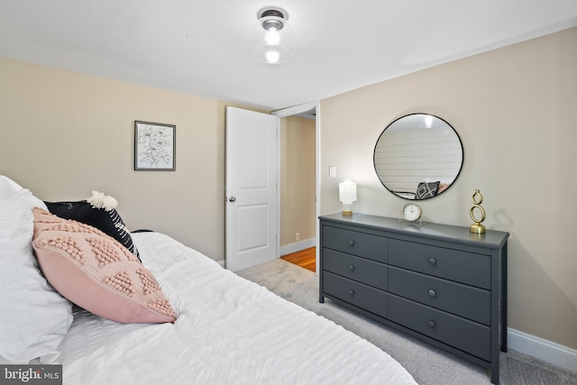 bedroom with light carpet