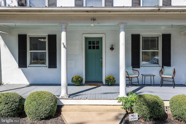 entrance to property with a porch