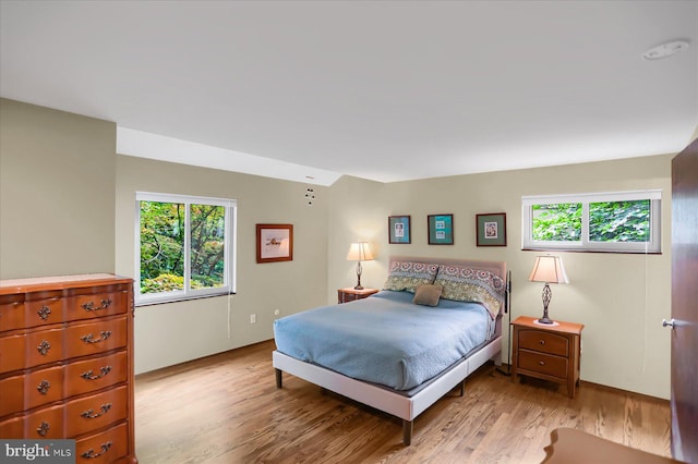 bedroom with light wood-type flooring