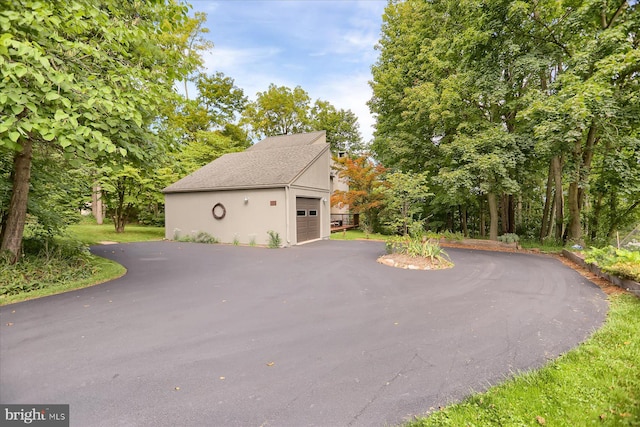 view of property exterior with a garage