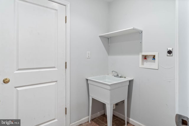 laundry area featuring electric dryer hookup, tile patterned flooring, and washer hookup