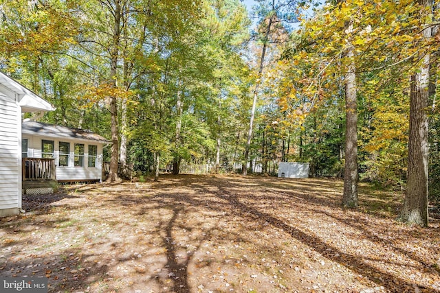 view of yard featuring a wooden deck