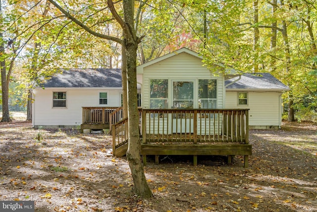 back of property with a deck