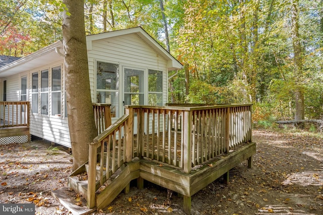 wooden terrace with a sunroom