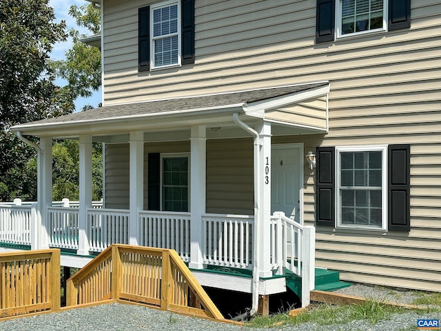 property entrance with covered porch