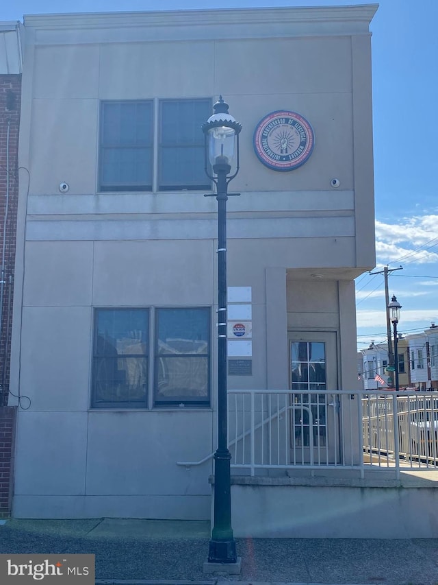 view of building exterior with fence