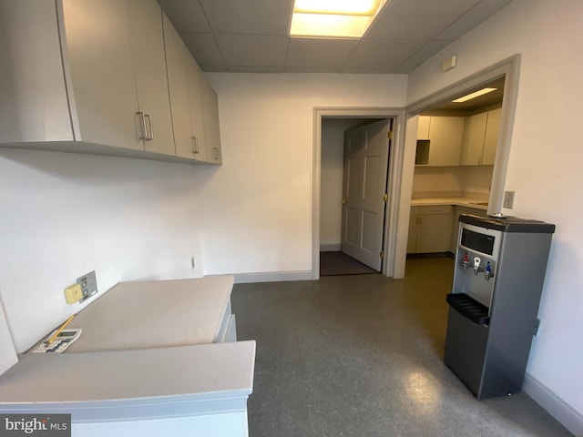 kitchen featuring a drop ceiling