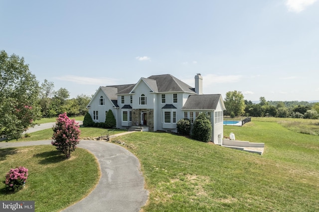 view of front of home with a front lawn