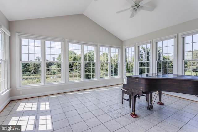 unfurnished sunroom with ceiling fan and vaulted ceiling