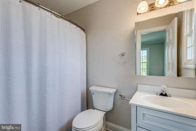 bathroom with toilet and vanity