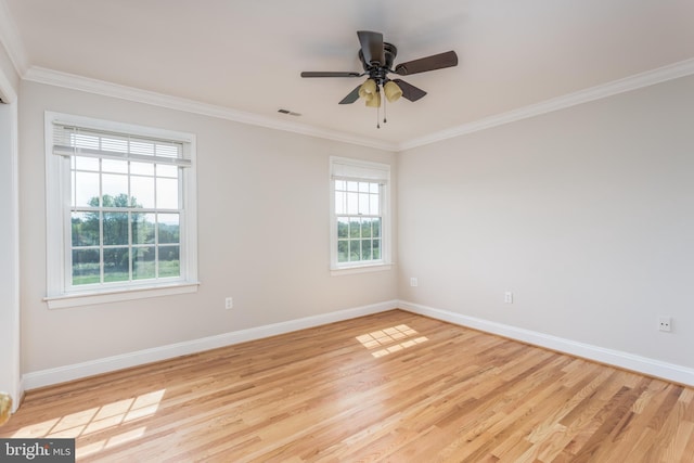 spare room featuring ceiling fan, ornamental molding, and light hardwood / wood-style floors