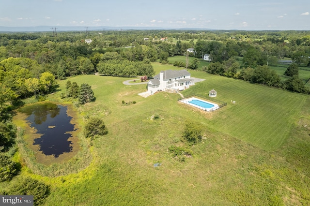 birds eye view of property featuring a water view and a rural view