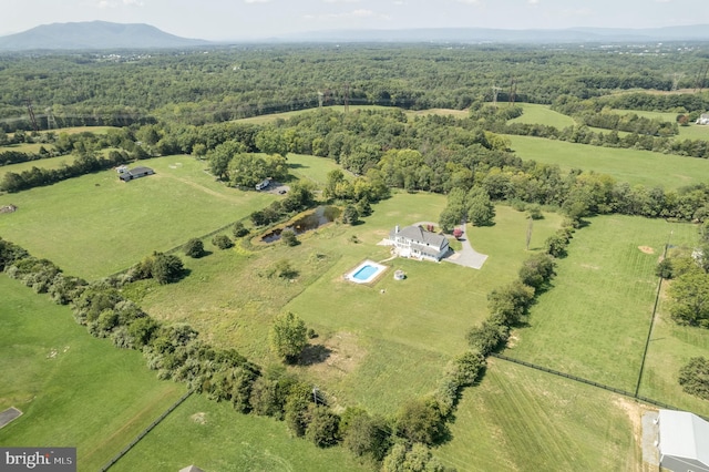 aerial view with a mountain view and a rural view