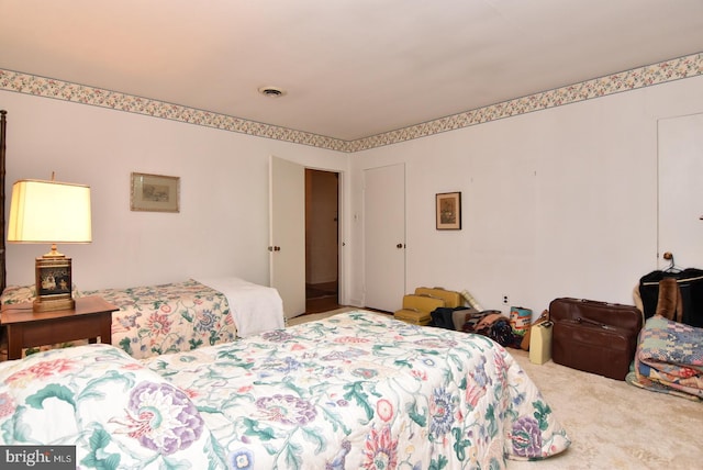 bedroom with carpet and visible vents