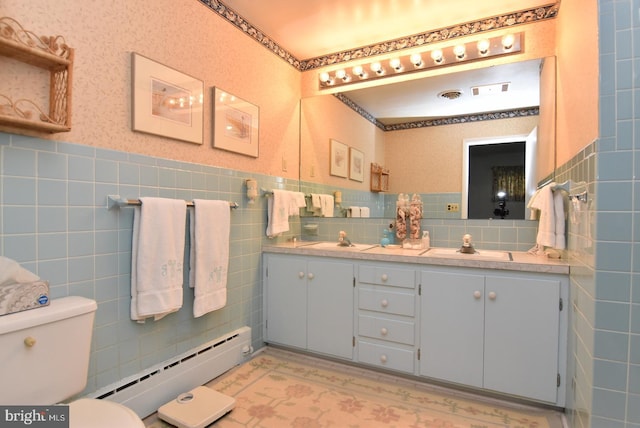 bathroom with vanity, tasteful backsplash, tile walls, toilet, and a baseboard heating unit