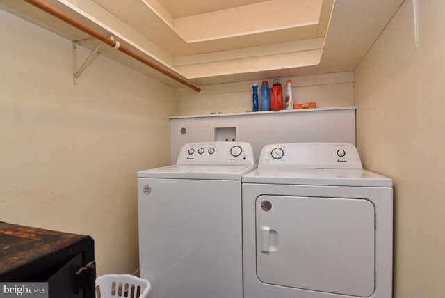 clothes washing area featuring washing machine and clothes dryer