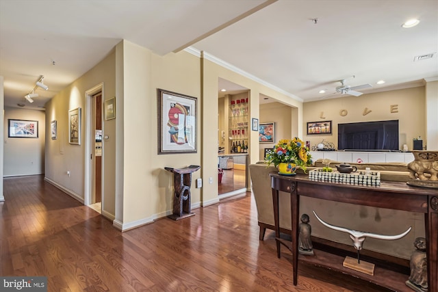 kitchen with crown molding, dark wood-type flooring, ceiling fan, and decorative backsplash