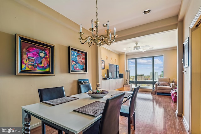 dining room featuring ceiling fan with notable chandelier, recessed lighting, crown molding, and wood finished floors