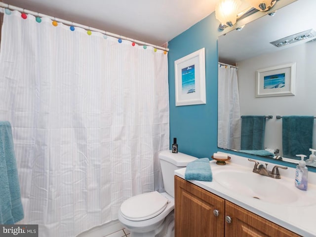 full bathroom with vanity and toilet