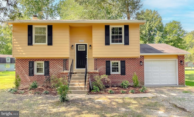 bi-level home featuring a garage