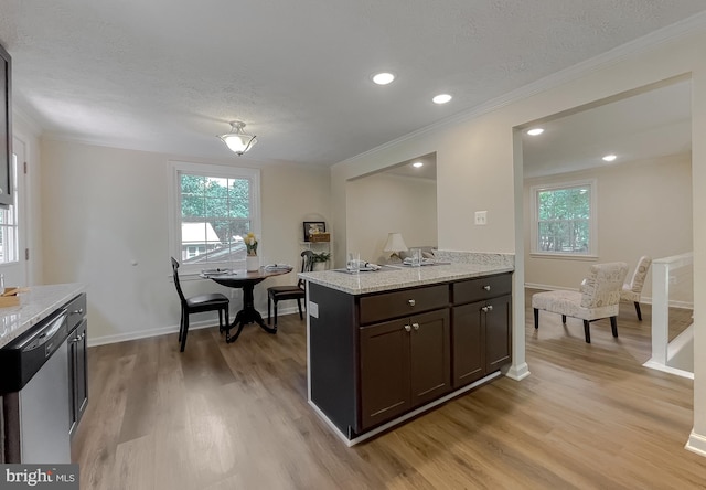 kitchen featuring dishwasher, crown molding, light wood-type flooring, dark brown cabinets, and a textured ceiling