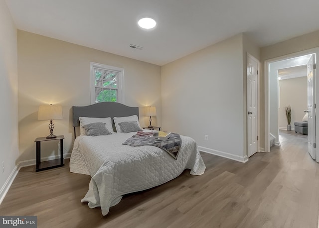 bedroom featuring hardwood / wood-style flooring