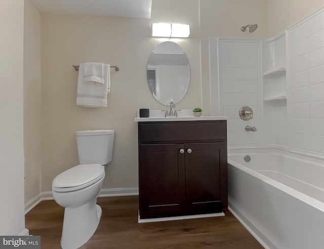 full bathroom with vanity, toilet, hardwood / wood-style flooring, and tub / shower combination