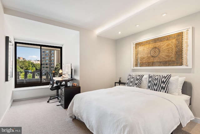 carpeted bedroom with baseboards, recessed lighting, and an office area