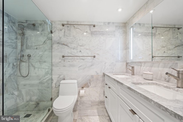 bathroom with tile walls, double vanity, a marble finish shower, toilet, and recessed lighting