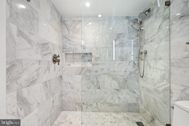 full bathroom with a walk in shower and toilet