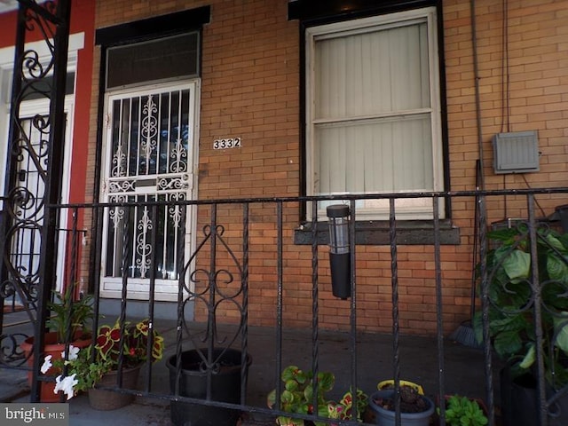 entrance to property with brick siding