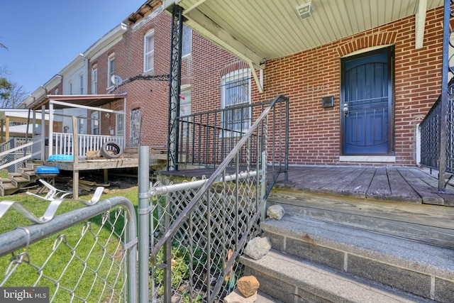 property entrance with a wooden deck