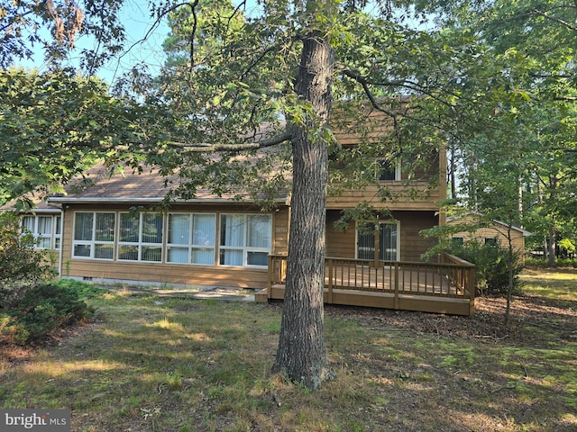 view of front of property with a wooden deck