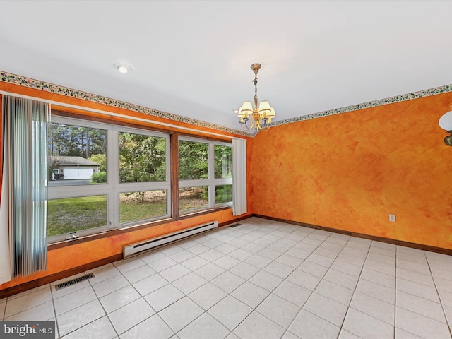 tiled empty room with baseboard heating and an inviting chandelier