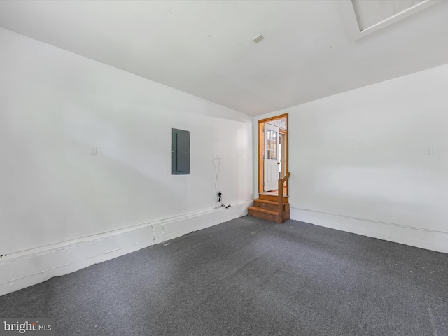 spare room with lofted ceiling and electric panel