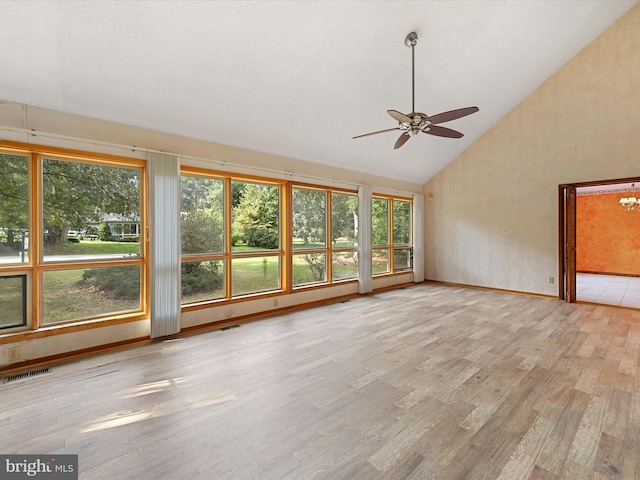 interior space featuring high vaulted ceiling, ceiling fan, and light hardwood / wood-style flooring