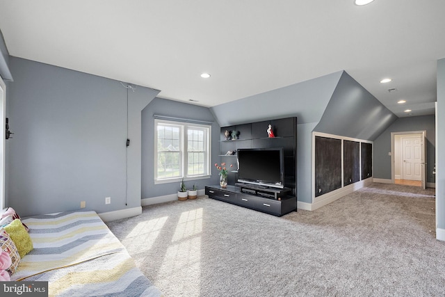 living room with carpet and vaulted ceiling