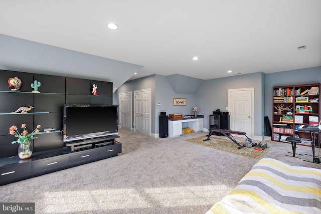 carpeted living room with lofted ceiling