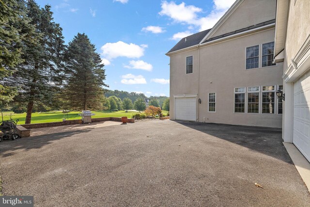 view of side of property with a garage