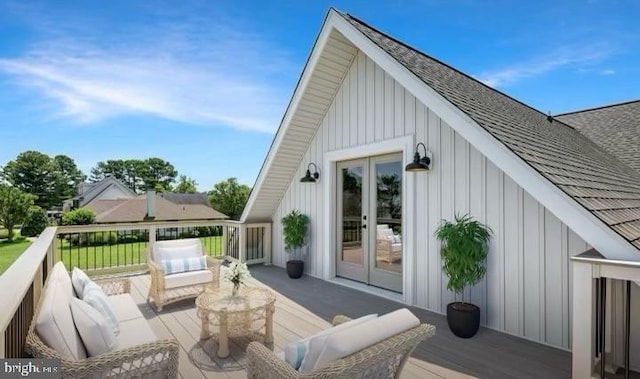 rear view of property with a wooden deck